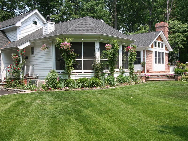 Exterior screened in porch with Andersen windows and hidden screen panels in Mt Lakes, NJ remodeled by JMC Home Improvement Specialists