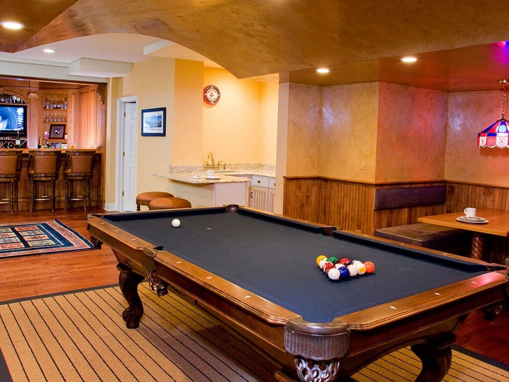 Award Winning Custom basement with pool table and arch ceiling with custom paint in Randolph New Jersey Renovated by JMC Home Improvement Specialists